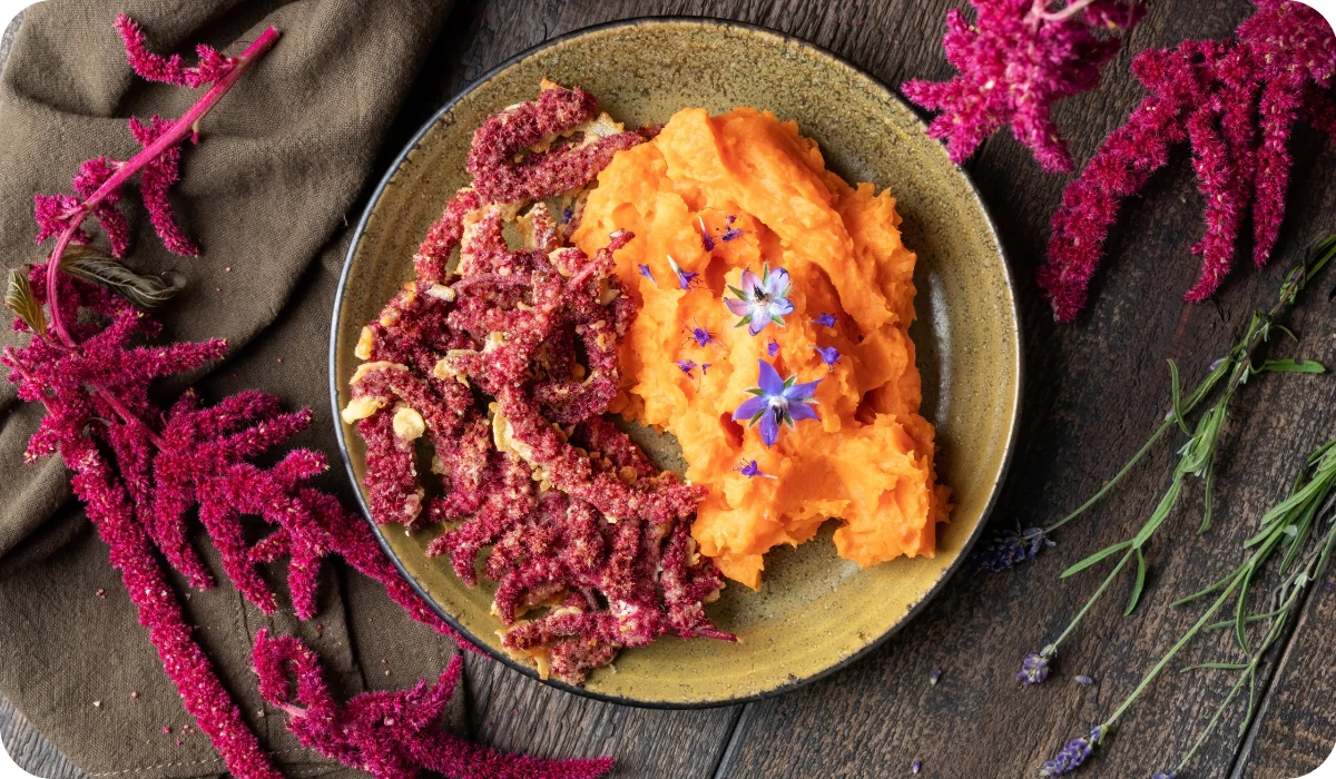 Fried Amaranthus caudatus flowers and sweet potato puree, decorated with borage flowers